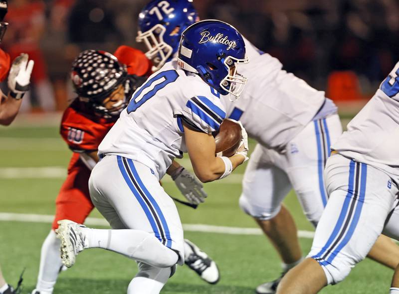 Riverside Brookfield's Jacob Retana (0) runs the ball during the varsity football game between Riverside Brookfield and Glenbard East on Friday, Oct. 24, 2025 in Lombard, IL.