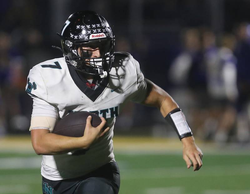 Woodstock North's Parker Halihan runs with the football during a Kishwaukee River Conference football game against Johnsburg on Friday, Sept. 26, 2025, at Johnsburg High School.
