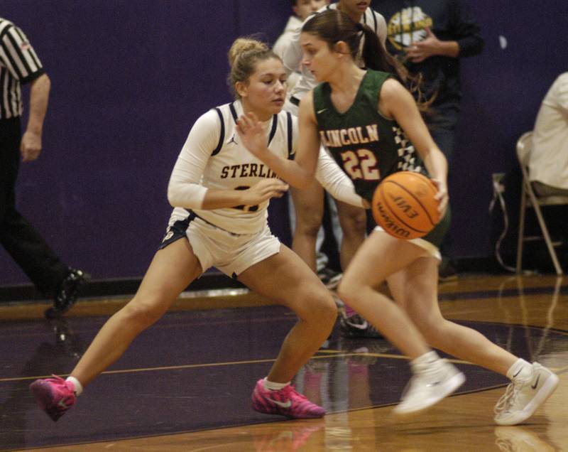Sterling's  Jaelynn  James  applies defensive pressure to Lincoln's  Paisley Holmes. The Sterling Golden Warriors played  the Lincoln Railsplitters in the Dixon Holiday Tournament at Reagan Middle School in Dixon on Friday, December 26th, 2025.