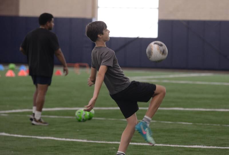 Jozef Frackiewicz of Glen Ellyn plays soccer during the Glen Ellyn Park District unplug from technology event held Saturday July 13, 2024.