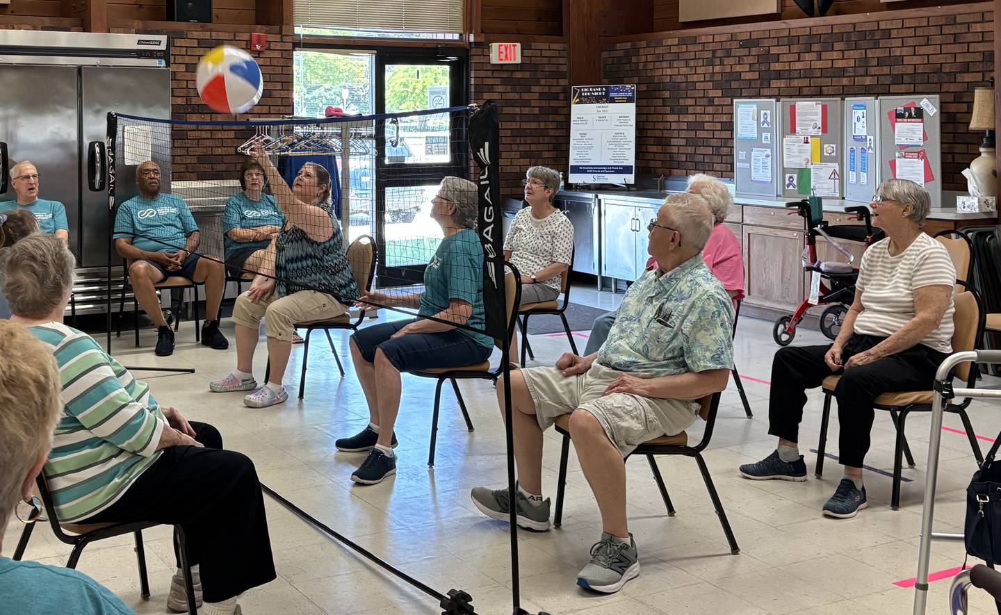 Designed to increase mobility and physical strength, chair volleyball is also a lot of fun. Pictured, seniors compete for the point at the Beecher Center in Yorkville.