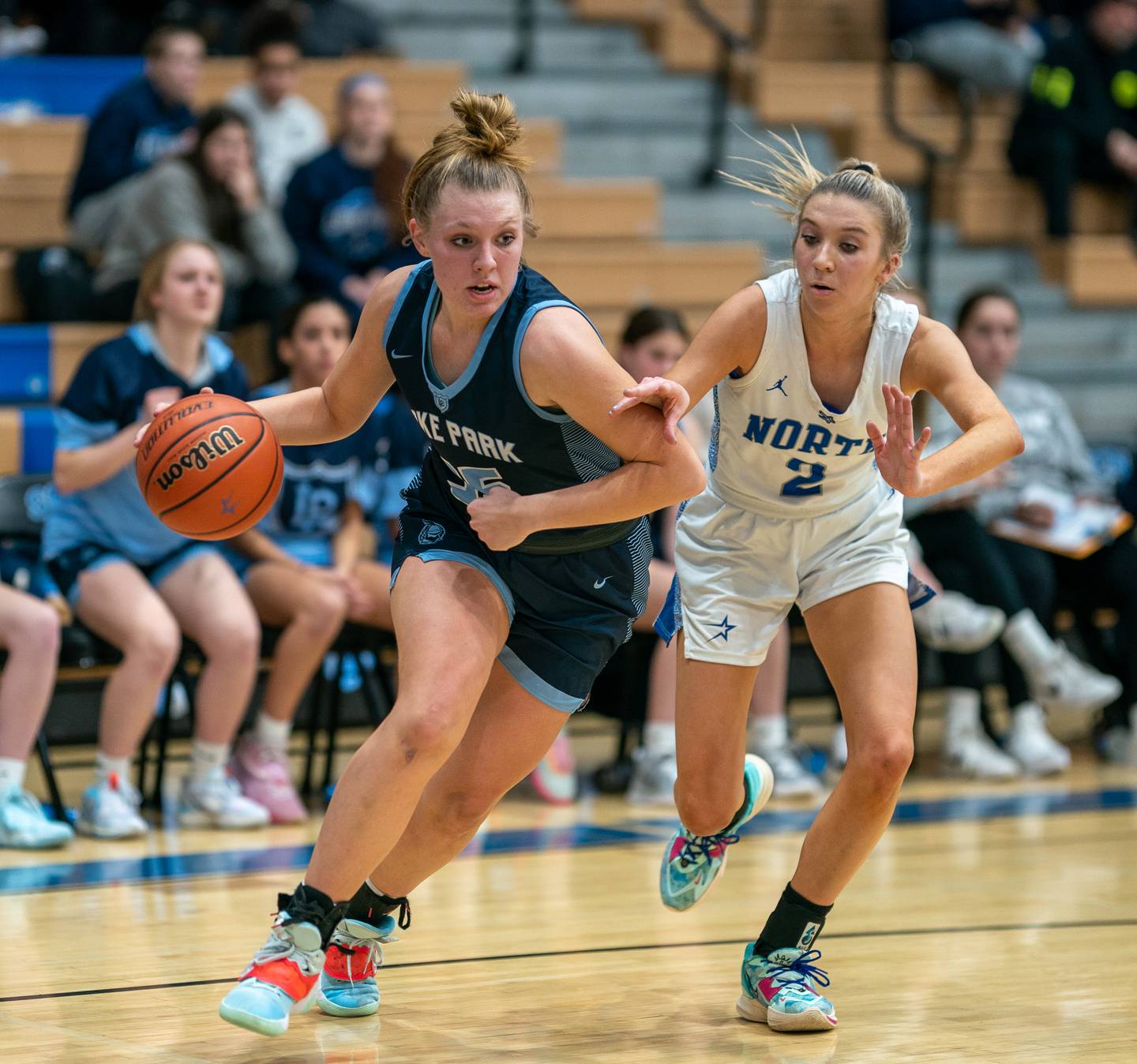 Lake Park's Grace Cord (35) drives the baseline against St.Charles North's Reagan Sipla (2) during a basketball game at St.Charles East High School on Wednesday, Dec 21, 2022.