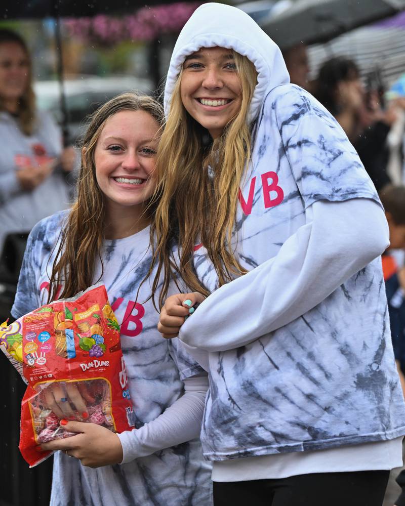Members of the Crystal Lake Central H.S. girls volleyball team seen in downtown Crystal Lake during the school's 100 year anniversary homecoming day parade on a rainy Saturday, Sep. 16, 2023 in Crystal Lake. The parade began at the high school and made its way through downtown Crystal Lake.