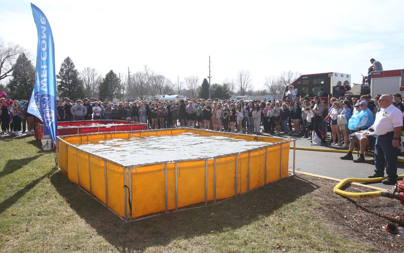 Hundreds of students, faculty and staff, along with Putnam County Police, Fire and EMS agencies gather to watch jumpers participate in the Polar Plunge to support Special Olympics on Friday, March 14, 2025 at Putnam County High School.