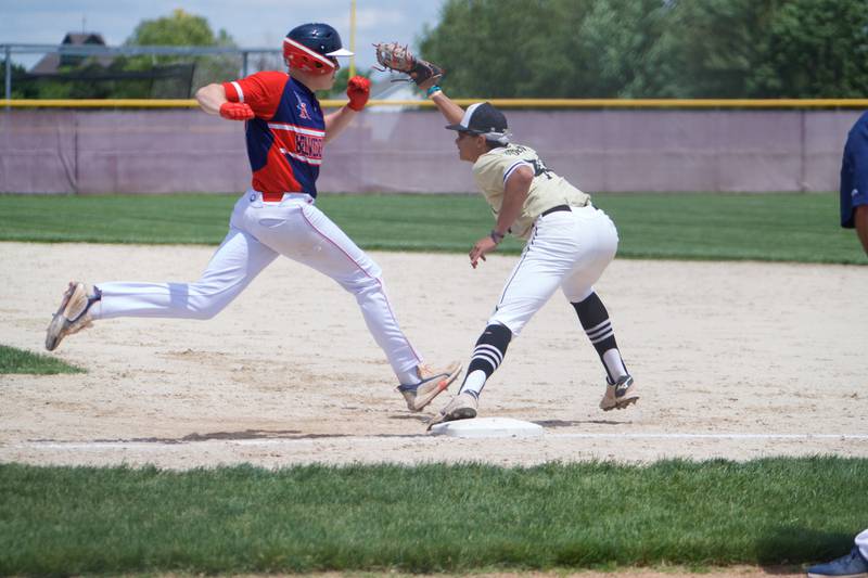 Sycamore's Tommy Townsend makes the stretch for the out before Belvidere North's Kyle Tuttle reaches the bag at the Class 4A Regional Final on May 28, 2022 in Belvidere.