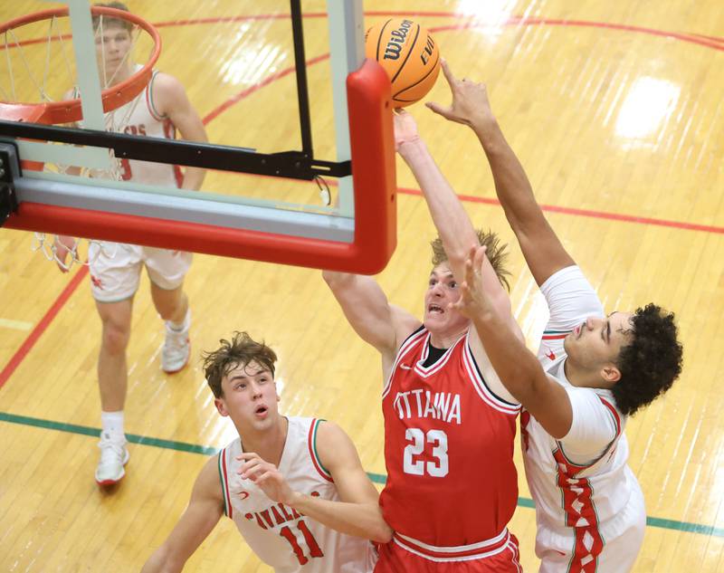 Ottawa's Owen Sanders gets a shot off in front of L-P's Marion Persich and teammate Jameson Hill on Friday, Jan. 9, 2026 in Sellett Gymnasium at L-P High School.