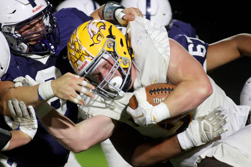 Cary-Grove’s Gabriel Rose stops Jacobs’ Caden DuMelle in varsity football on Friday, Sept. 20, 2024, at Al Bohrer Field on the campus of Cary-Grove High School in Cary.