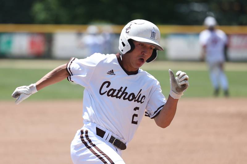 Joliet Catholic’s Tommy Kemp rounds third to score against Spring Valley Hall in the Class 2A Geneseo Supersectional on Monday, May 29, 2023 in Geneseo.