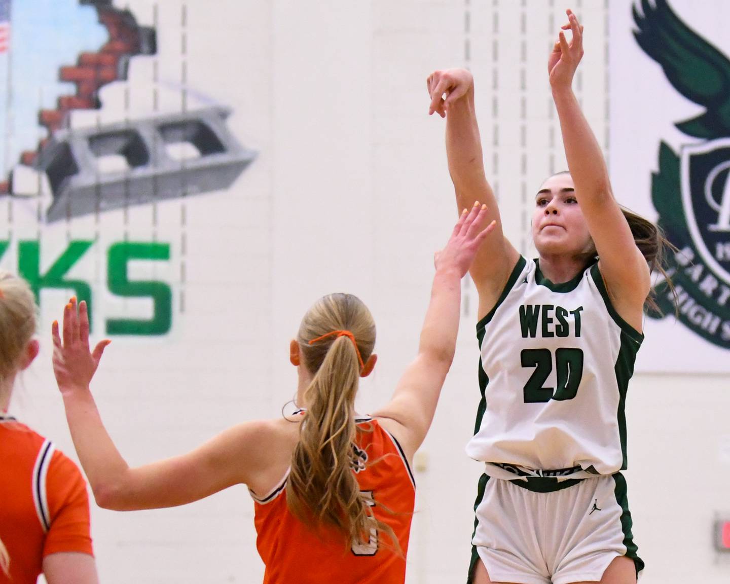 Glenbard West's Ellie Noble (20) takes a shot while being defended by St. Charles East's Brooklyn Schilb (5) during the 4A Sectional championship game on Thursday Feb. 26, 2026, held at Bartlett High School.