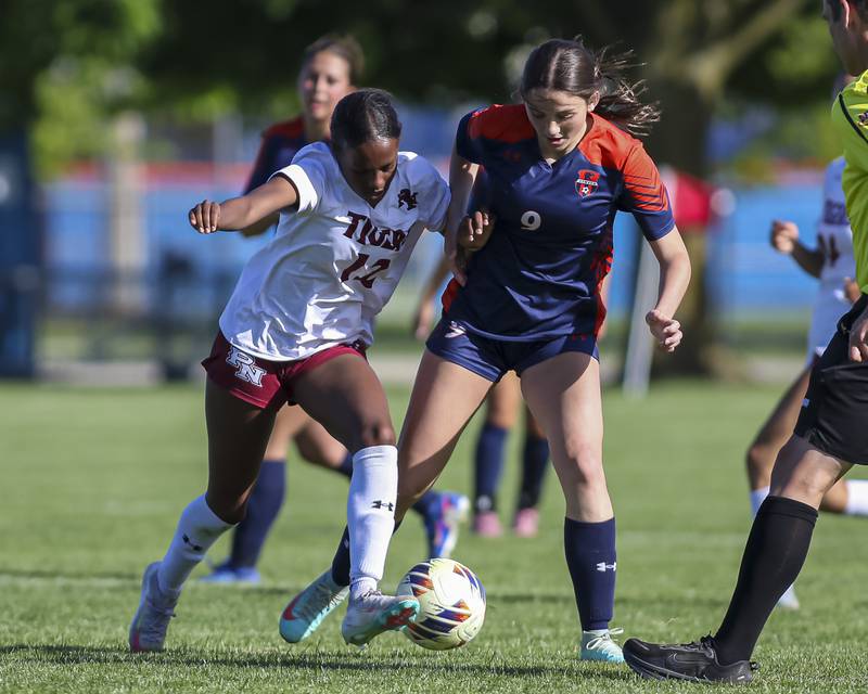 Oswego's Elizabeth Johnson (9) defends Oswego's Jourdan Henderson (12) during a soccer match between Plainfield North at Oswego on Monday, May 11, 2026 in Oswego.