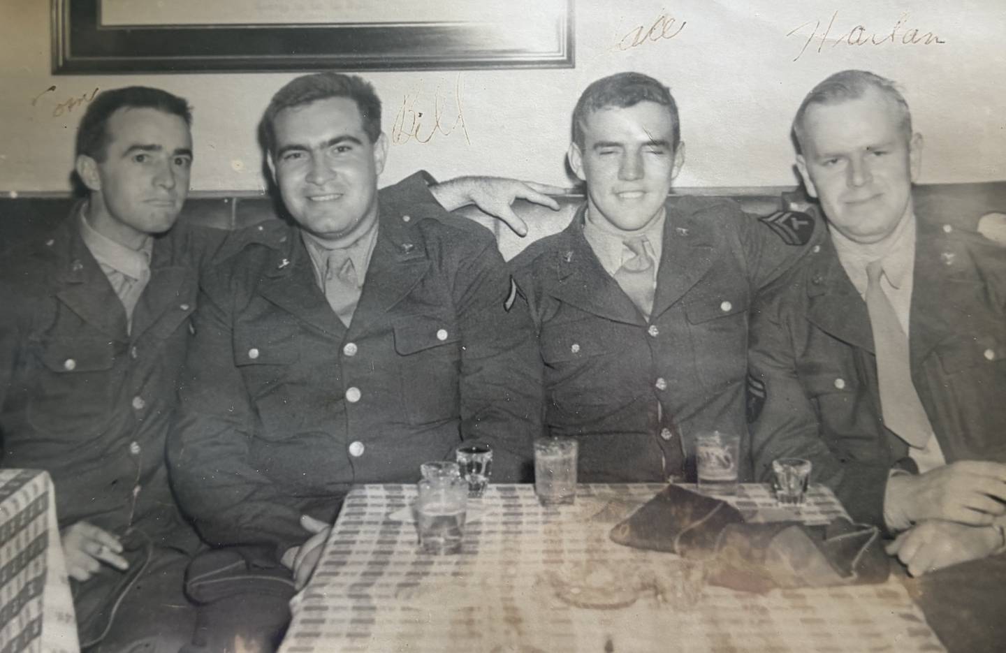 Harold Beck (second from left) sits with fellow military members during his time in the United States Army.