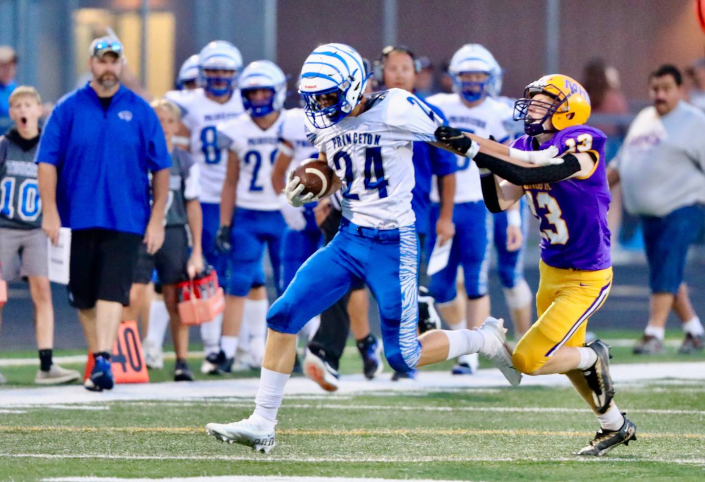 Princeton's Danny Cihocki tries to run away from the grasps of Mendota's Ryne Strouss Friday night.