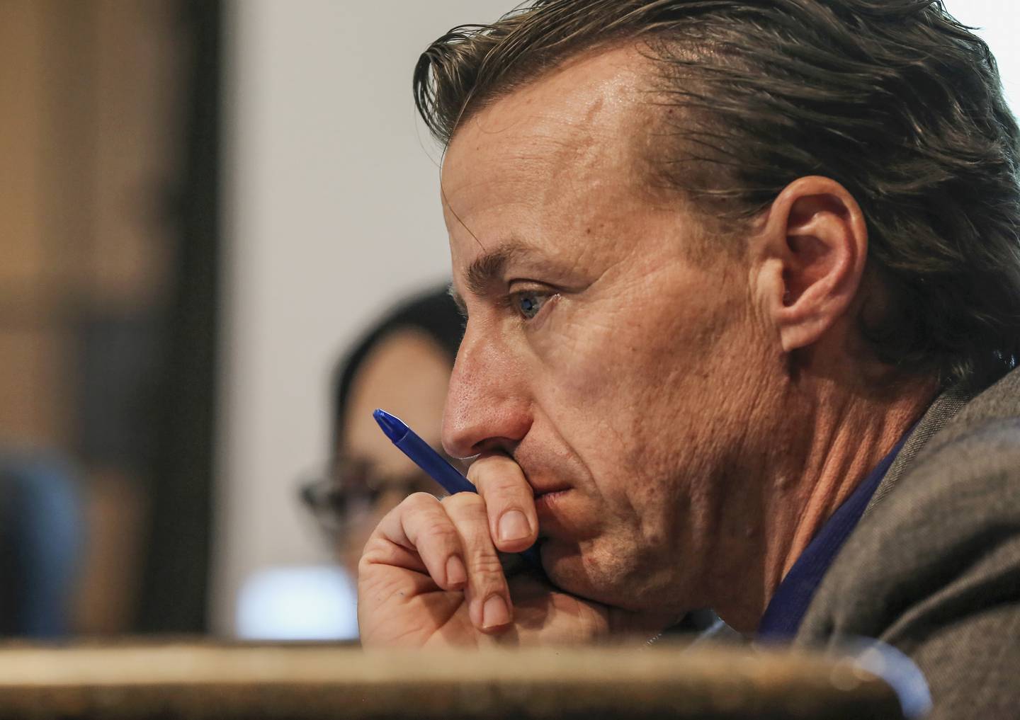 Interim Joliet City Manager Marty Shanahan looks over a budget report Tuesday, Dec. 4, 2018, during a city council meeting at Joliet City Hall in Joliet, Ill.