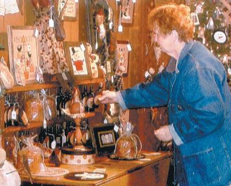 A shopper looks at a potential Christmas present at a previous Ellen Oaks Christmas Craft Show in this undated historic photo. The show is now called the Genoa-Kingston Christmas Craft Show, which celebrates 50 years in 2024. Provided photo.