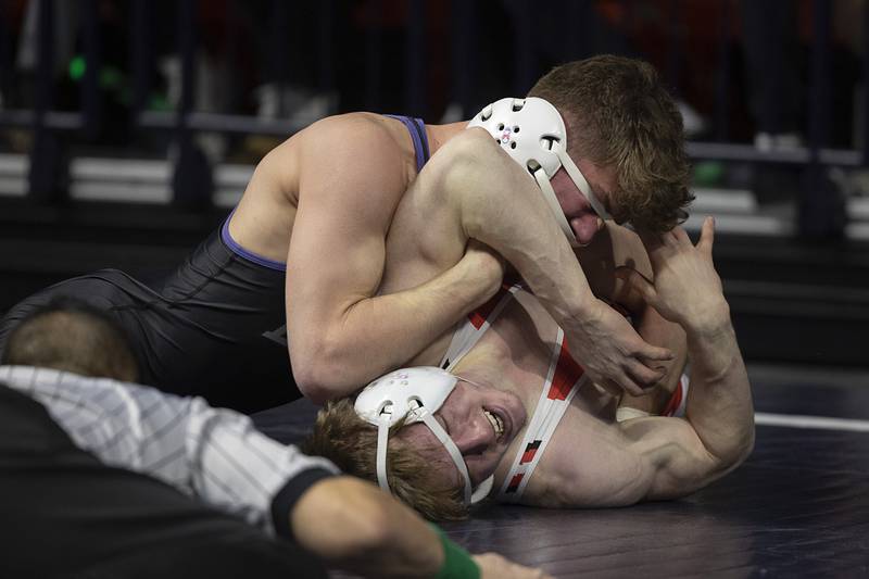 Dixon’s Charlie Connors works on Garrett VerHeecks of Unity Christian in the 144 pound title match Saturday, Feb. 21, 2026, at the IHSA wrestling finals in Champaign.