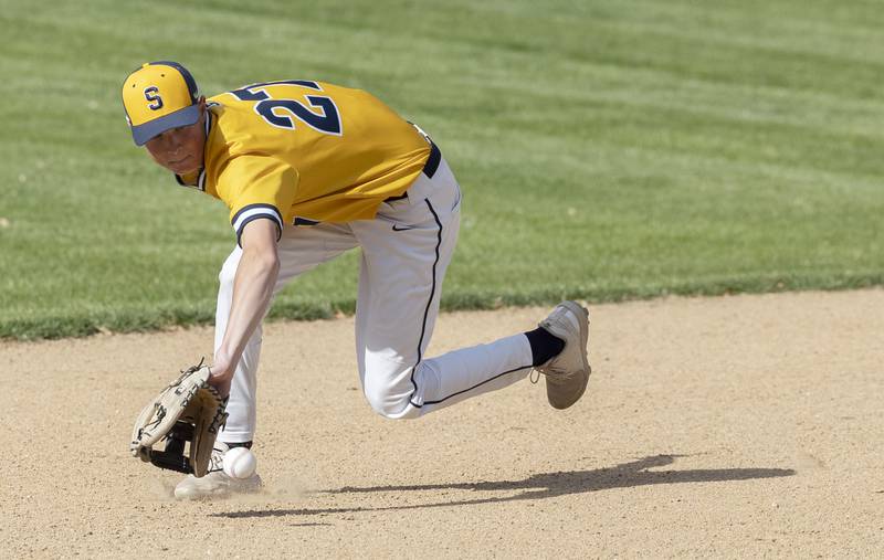 Sterling’s Bryce Hartman goes deep in the hole to make a play against Dixon Friday, May 23, 2025.
