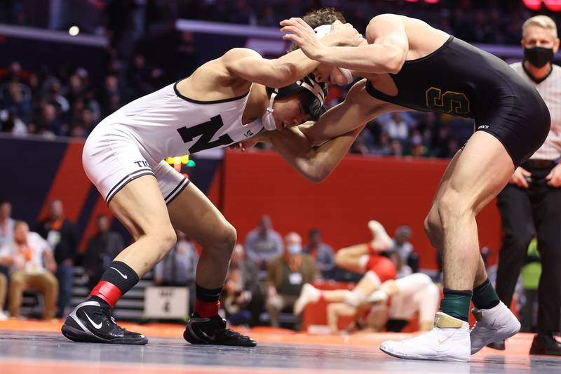 Plainfield North’s Jacob Macatangy (left) wraps up with Stevenson’s Lorenzo Frezza in the Class 3A 126lb. 3rd place match at State Farm Center in Champaign. Saturday, Feb. 19, 2022, in Champaign.