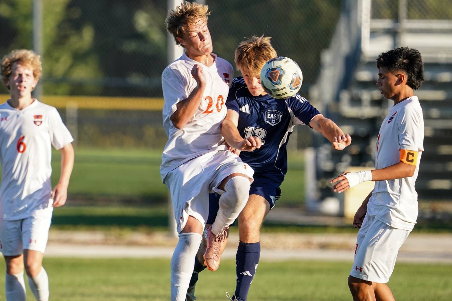Oswego’s Ryan Maveus (20) challenges Oswego East's Ryan Brandt (12) for the ball during a Southwest Prairie Conference game at Oswego East High School on Thursday, Sept. 25, 2025.