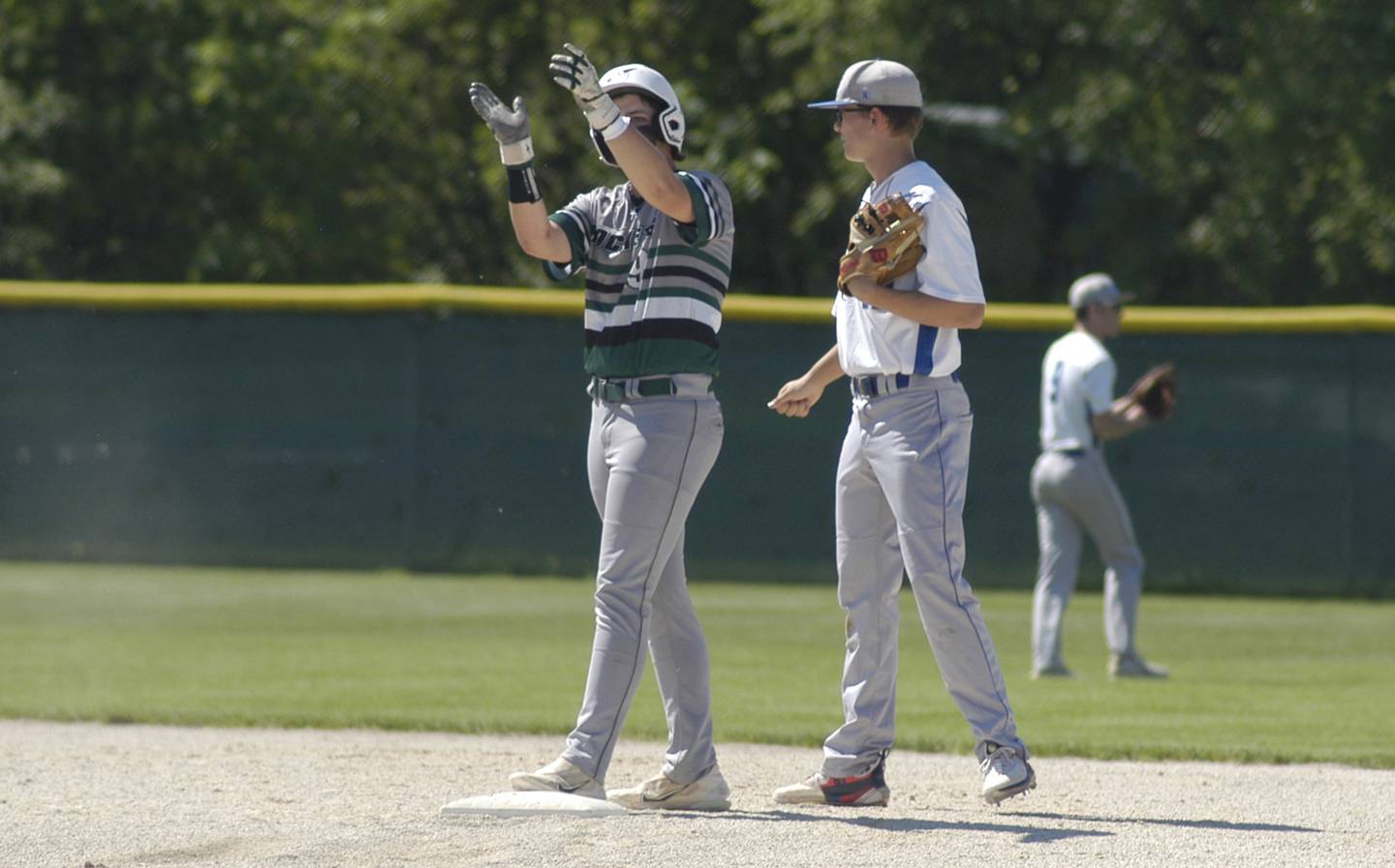 RF baserunner Colby Ward applauds his teammate's hit.. The action took place in the 2A Regional baseball game at Larry Ybarra field at Newman High School, Saturday, May 18th 2024.