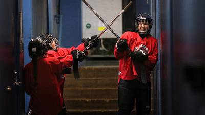 Photos: NIU hockey team teaches sport at camp in Geneva