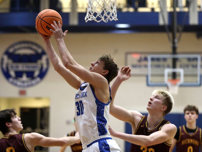 Woodstock's Ty Steponitis drives to the basket against Richmond-Burton's Luke Robinson during a Kishwaukee River Conference boys basketball game on Wednesday, February. 4, 2026, at Woodstock High School.