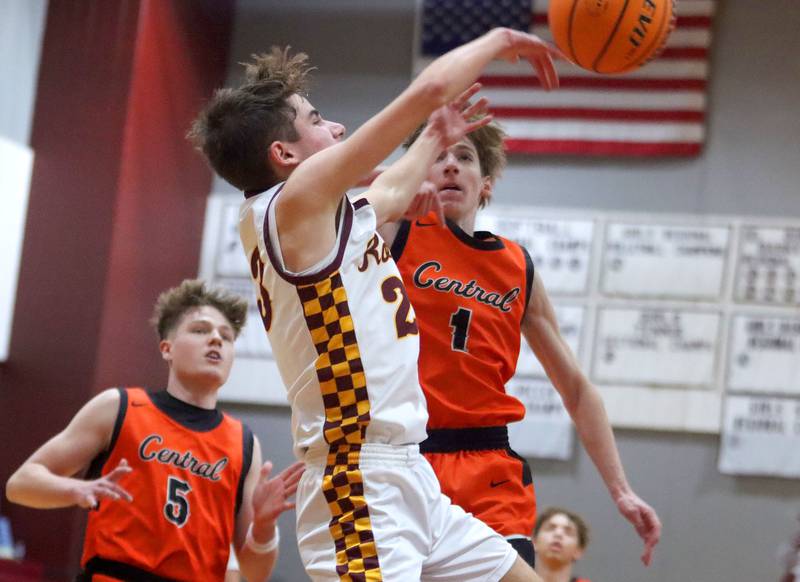 Richmond-Burton’s Will Gardner, front, dishes the ball under the net against Crystal Lake Central in varsity boys basketball E.C. Nichols tournament championship game action on Saturday, Dec. 27, 2025, at Homer “Bill” Barry Gymnasium on the campus of Marengo High School in Marengo.
