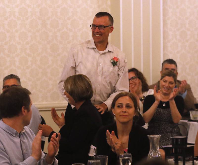 People clap for Dan Schirmer of Marengo High School after he won the high school award during the the Educator of the Year Dinner, Saturday, May 6, 2023, at Hickory Hall, in Crystal Lake. The annual awards recognize McHenry County’s top teachers, administrators and support staff.