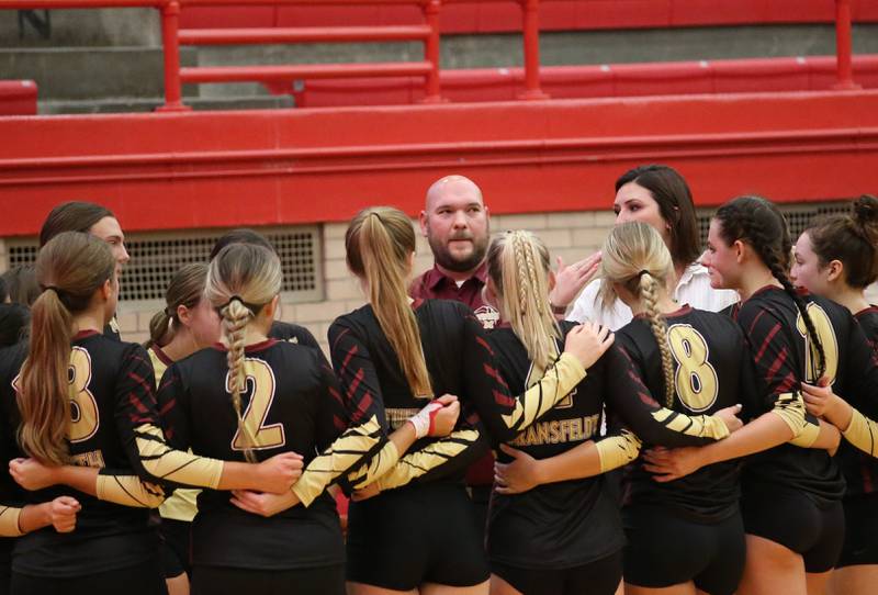 Morris head volleyball coach Scott Howell huddles with his team during a timeout against Ottawa on Tuesday, Sept. 12, 2023 in Kingman Gym at Ottawa High School.