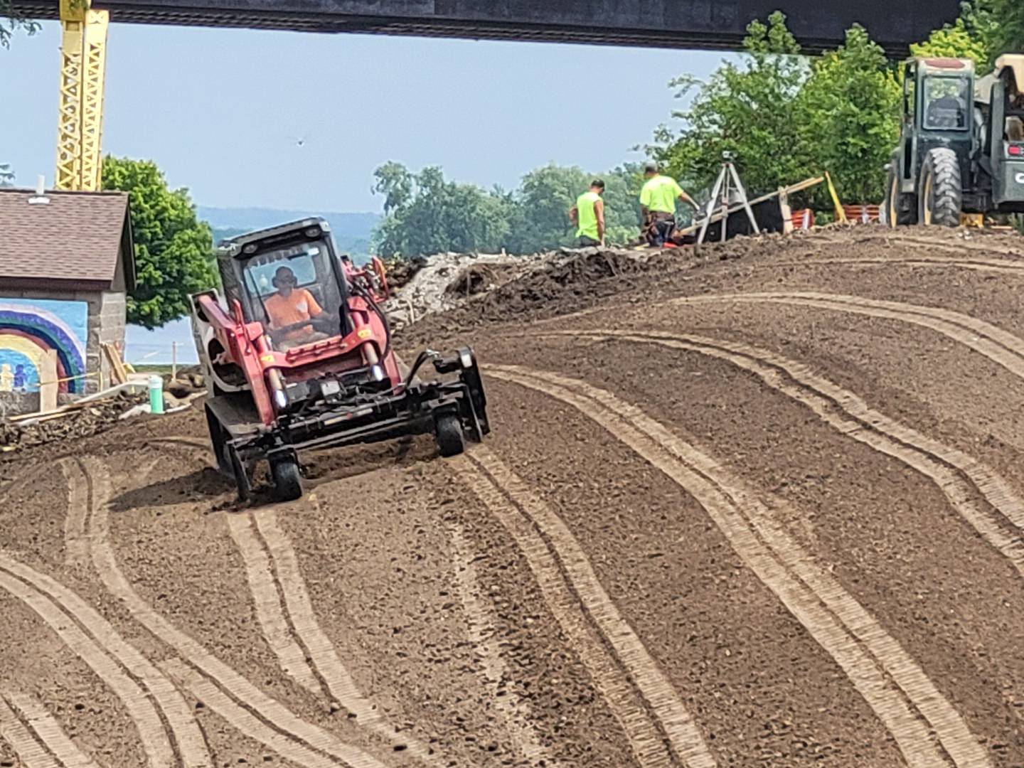 A grader from Vissering Construction of Streator takes another swipe at grading the hill at Ottawa's Allen Park on Tuesday.