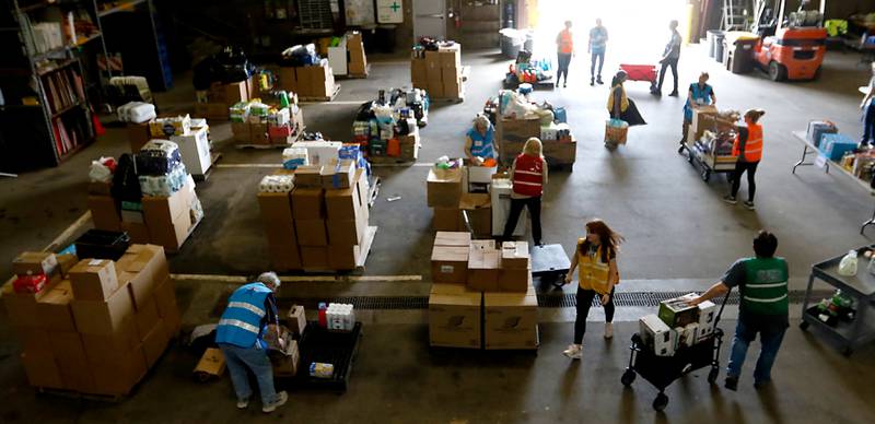 McHenry County Department of Health staff and volunteers from the McHenry County Medical Reserve Corp sort items during the Operation Dropbox Exercise on Tuesday , June 11, 2024, at the McHenry County Division of Transportation near Woodstock. The training exercise simulates the process of unloading and distributing medical counter-measures during emergencies along with helping to sort and distribute the donated items to veterans and their families in the county.