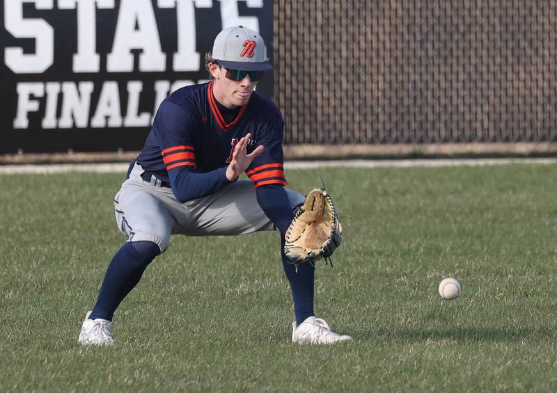 Naperville North's Matt Cantrell fields a ball in left field Tuesday, April 15, 2025, during their game at DeKalb High School.