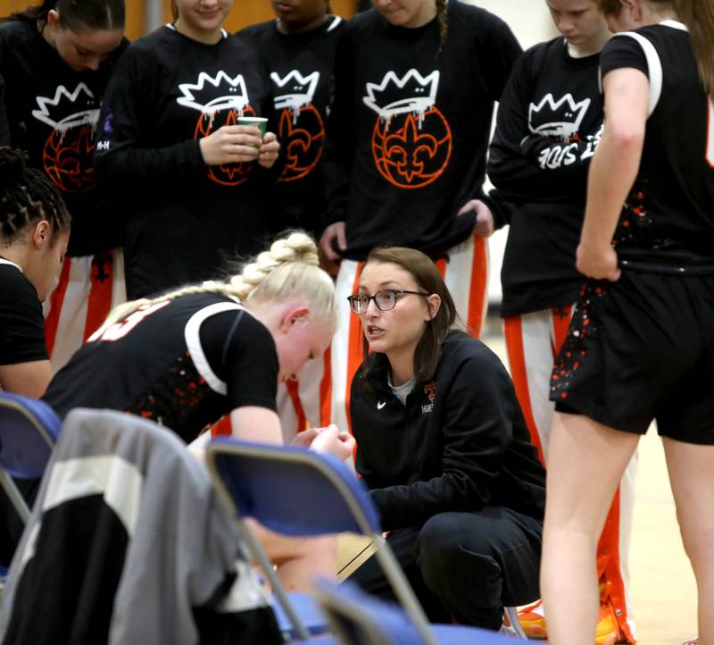 St. Charles East Head Coach Katie Claussner talks to her team between quarters during a game on Tuesday, Dec. 10, 2024 against Wheaton North in Wheaton.