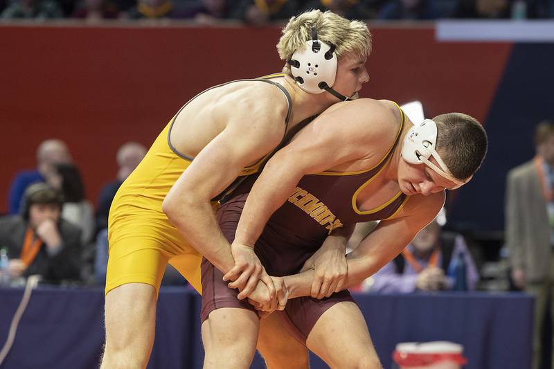 Richmond-Burton’s Blake Livdahl (right) and Lena-Winslow’s Eli Larson compete in the 175 pound weight class of the 1A state individual wrestling finals Saturday, Feb. 22, 2025, at State Farm Center in Champaign.
