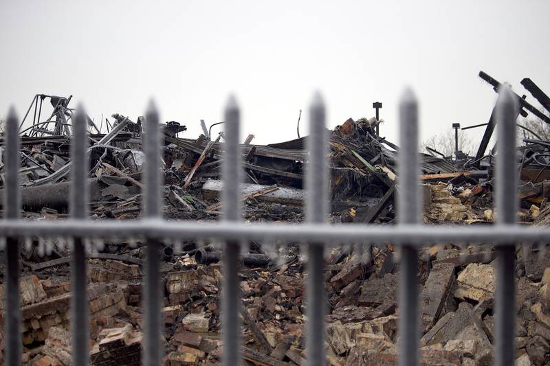 The destroyed remains of a commercial building seen on Friday, Jan. 30, 2026, near South Eastern Avenue and Washington Street in Joliet. The building was demolished following a fire on Thursday, Jan. 29, 2026.