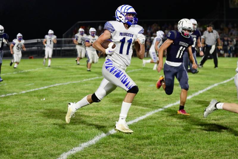 Princeton's Noah LaPorte races down the sidelines for a touchdown at Monmouth-Roseville Friday night. Princeton won 40-0.