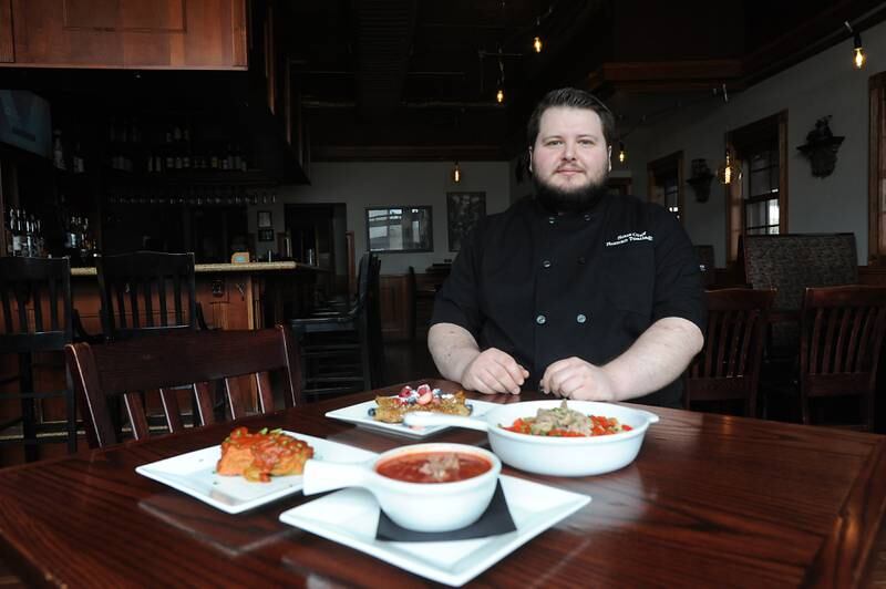 Sous-chef Roman Tsallagov with the  Ukrainian meal special that he made for the Bold American Fare restaurant in Algonquin. The special features borscht, holubtsi, banosh and mlyntsi, and all proceeds from the four-course meal are donated to Razom for Ukraine.