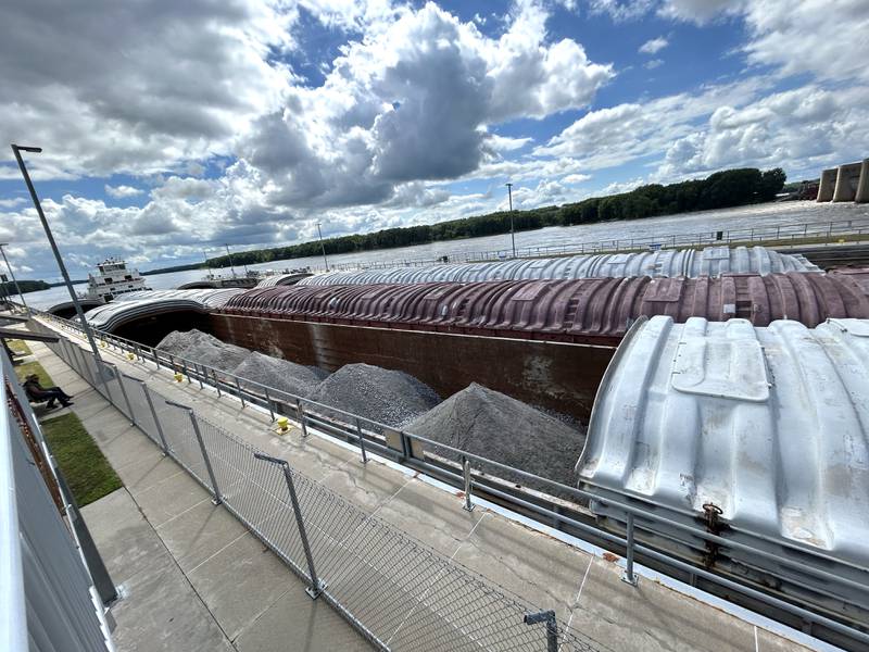 The towboat Neil N Diehl pushes barges up the Mississippi River through the lock at Lock & Dam 13 near Fulton on Sunday, July 6, 2025.