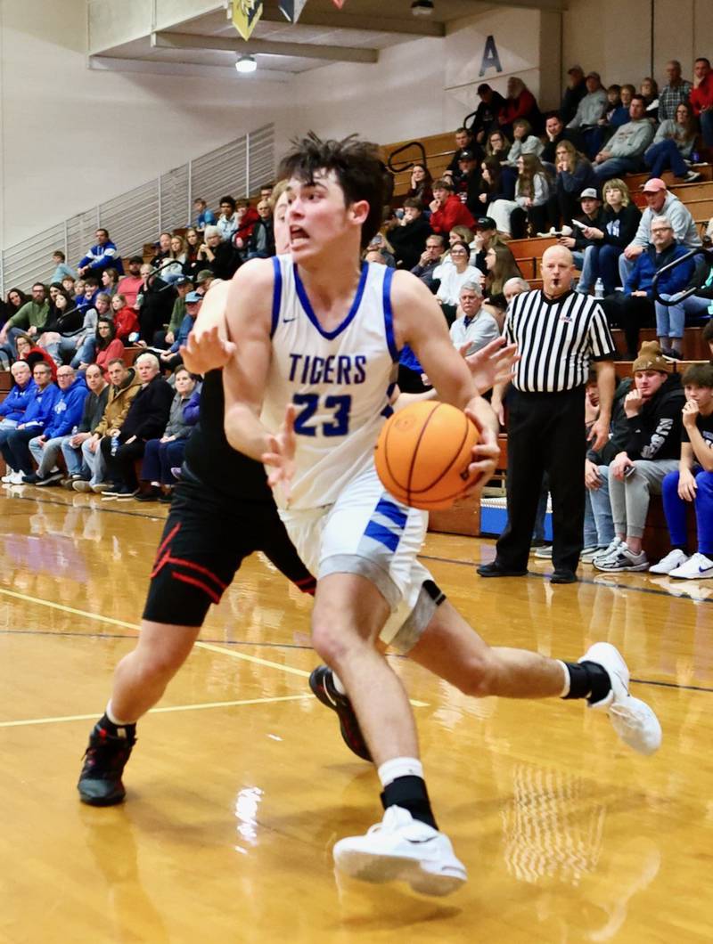 Princeton senior Noah LaPorte drives against Erie-Prophetstown Friday night at Prouty Gym. the Tigers won 60-37.