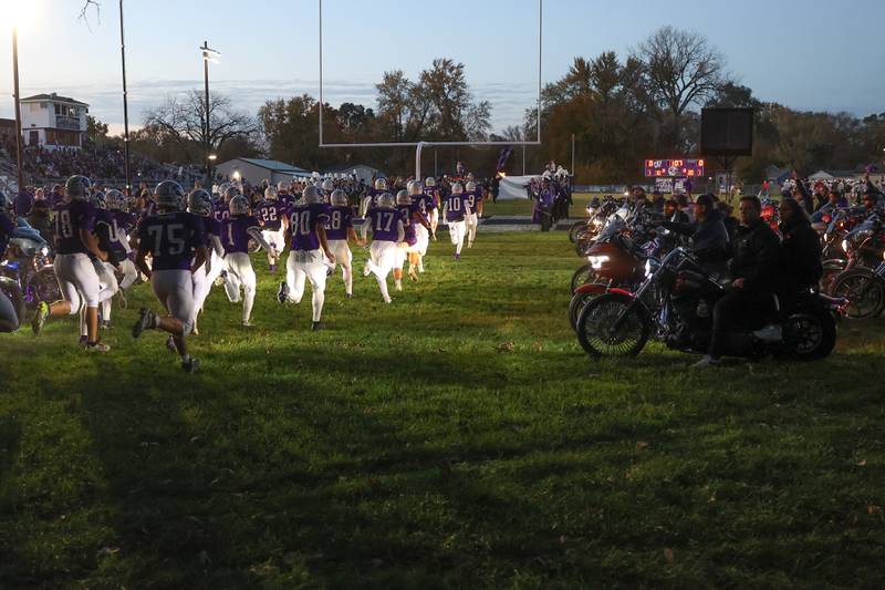 Bikers line up on the field as the Wilmington players enter the stadium before the game against Stillman Valley in the first round of the playoffs on Saturday, Nov. 2, 2024 in Wilmington.