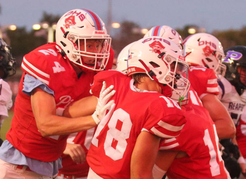Ottawa's Weston Averkamp celebrates with teammate Jack Pongracz after scoring a touchdown on Friday, Aug. 30, 2024 at King Field.
