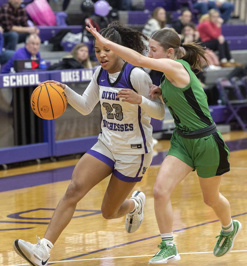 Dixon's Ahmyrie McGowan drives against Rock Falls’ Miley Bickett Friday, Jan. 31, 2025, at Dixon High School.