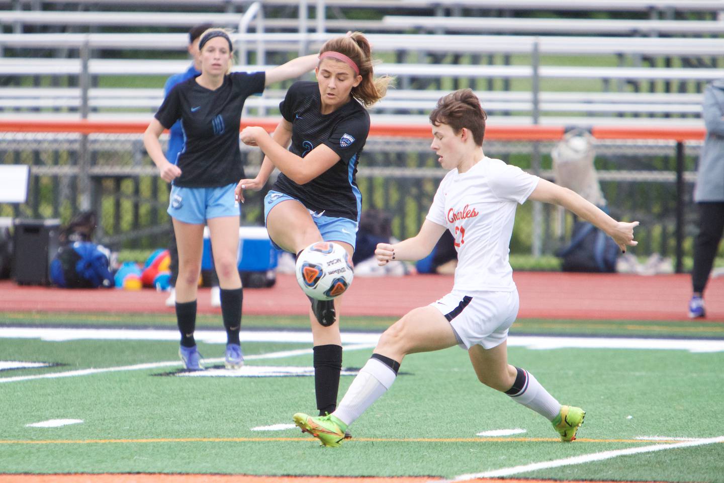 St. Charles North's Kayla Floyd battles for the ball with St. Charles East's Kara Machala at the Class 3A Sectional Final on May 27, 2022 in St. Charles.