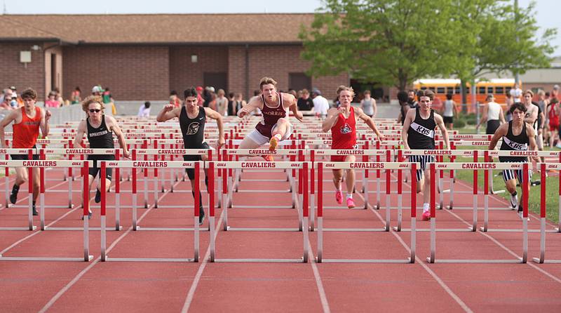(From left) Sandwich's Dylan Young, Sycamore's Daniel Martin, Vincent Brito, Morris's Noah Smith, Ottawa's Weston Averkamp, Kaneland's Luke Gradomski and Trevor Neal compete in the 110 meter hurdles during the I-8 Boys Conference Championship track meet on Thursday, May 11, 2023 at the L-P Athletic Complex in La Salle.