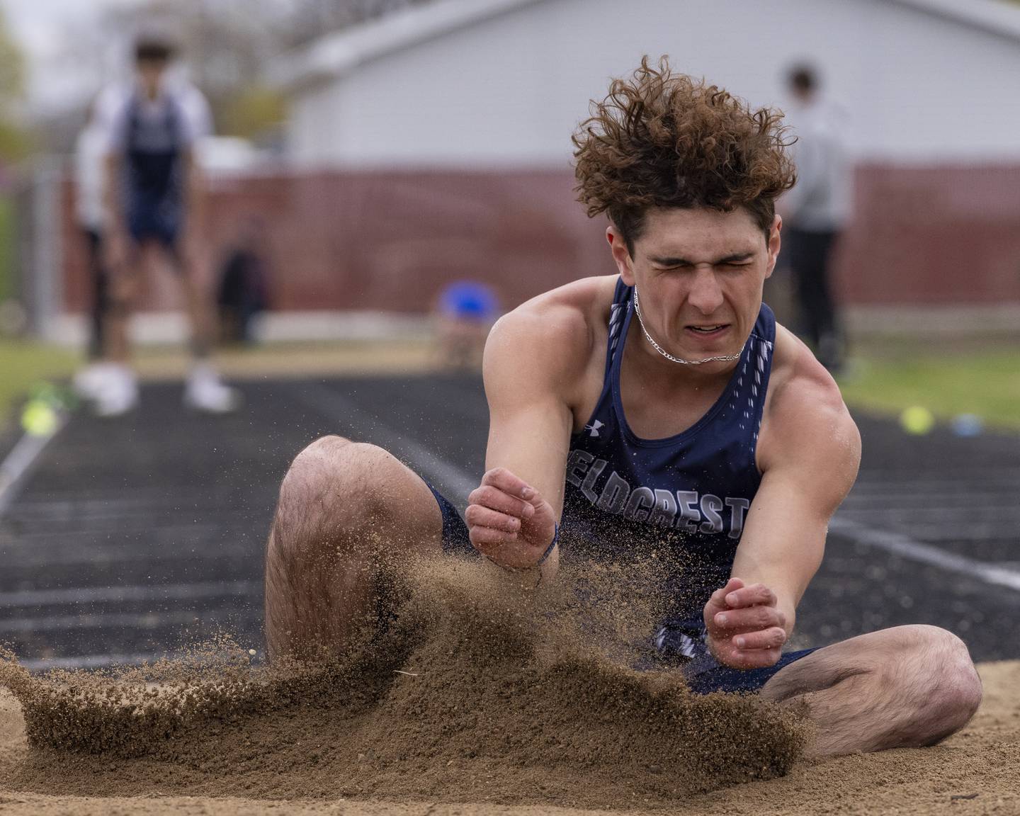 Michael Beckett of Fieldcrest High School impacts the sand during the boys long jump event during the Rollie Morris Invite on April 19, 2025 at Hall High School.
