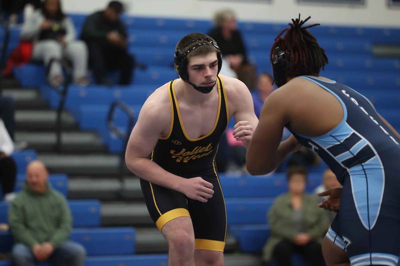 Joliet West’s Jacob Tyderek faces off against Plainfield South’s Jamal Jones Jr. in the 215-pound match on Wednesday, Dec. 11, 2024 in Plainfield.