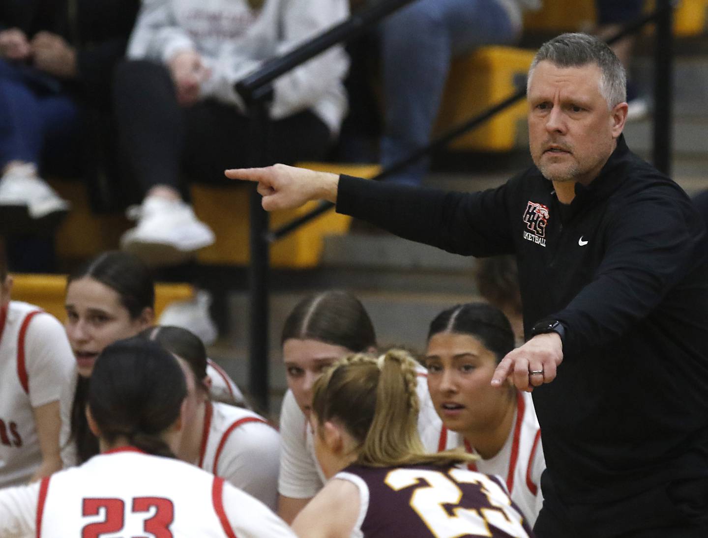 Huntley Head Coach Steve Raethz directs the Huntley defense during the IHSA Class 4A Gurnee Warren Supersectional girls basketball game against Loyola Academy on Monday, March 3, 2025, at Warren Township High School in Gurnee.
