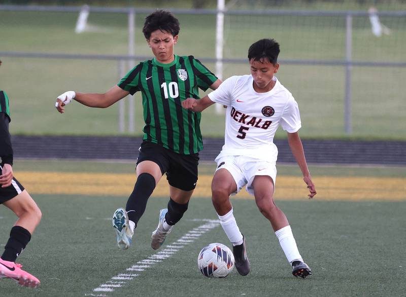 DeKalb's Brandon Cervantes and St. Edward's Ben Aguirre go after a loose ball Thursday, Aug. 28, 2025, during their game in the Barb Cup tournament at DeKalb High School.