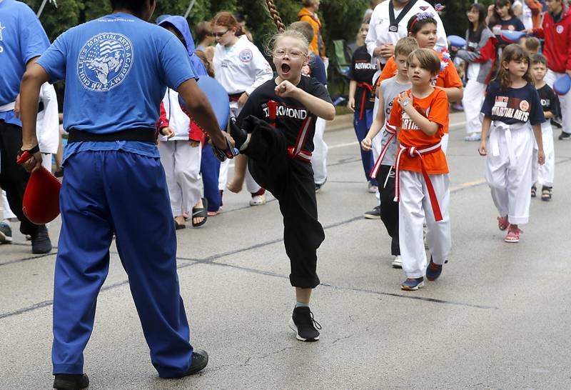 Students from Lee’s Martial Arts kick their way down the parade route on Sunday, July 2, 2023 during Crystal Lake’s annual Independence Day Parade on Dole Avenue in Crystal Lake. This year’s parade feature close to 100 units.