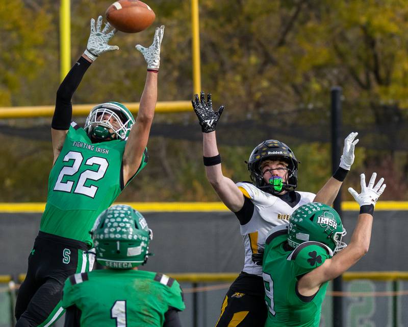 Brayden Simek (22) of Seneca looks to intercept pass intended for Caen Beckett (1) of Riverdale on Saturday, November 1, 2025 at Seneca High School in Seneca.