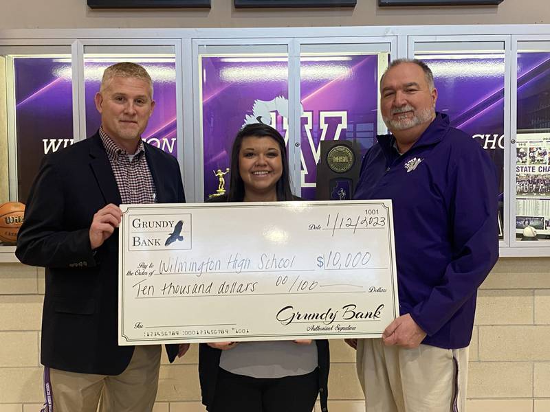 Wilmington High School approached Grundy Bank and asked if there would be interest in sponsoring or donating to the purchase of new scoreboards. Grundy Bank gave the news that they would help fund two new scoreboards for the inside gymnasium – in the form of a $10,000 check.